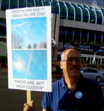 Protest holding 'Chemtrails' sign